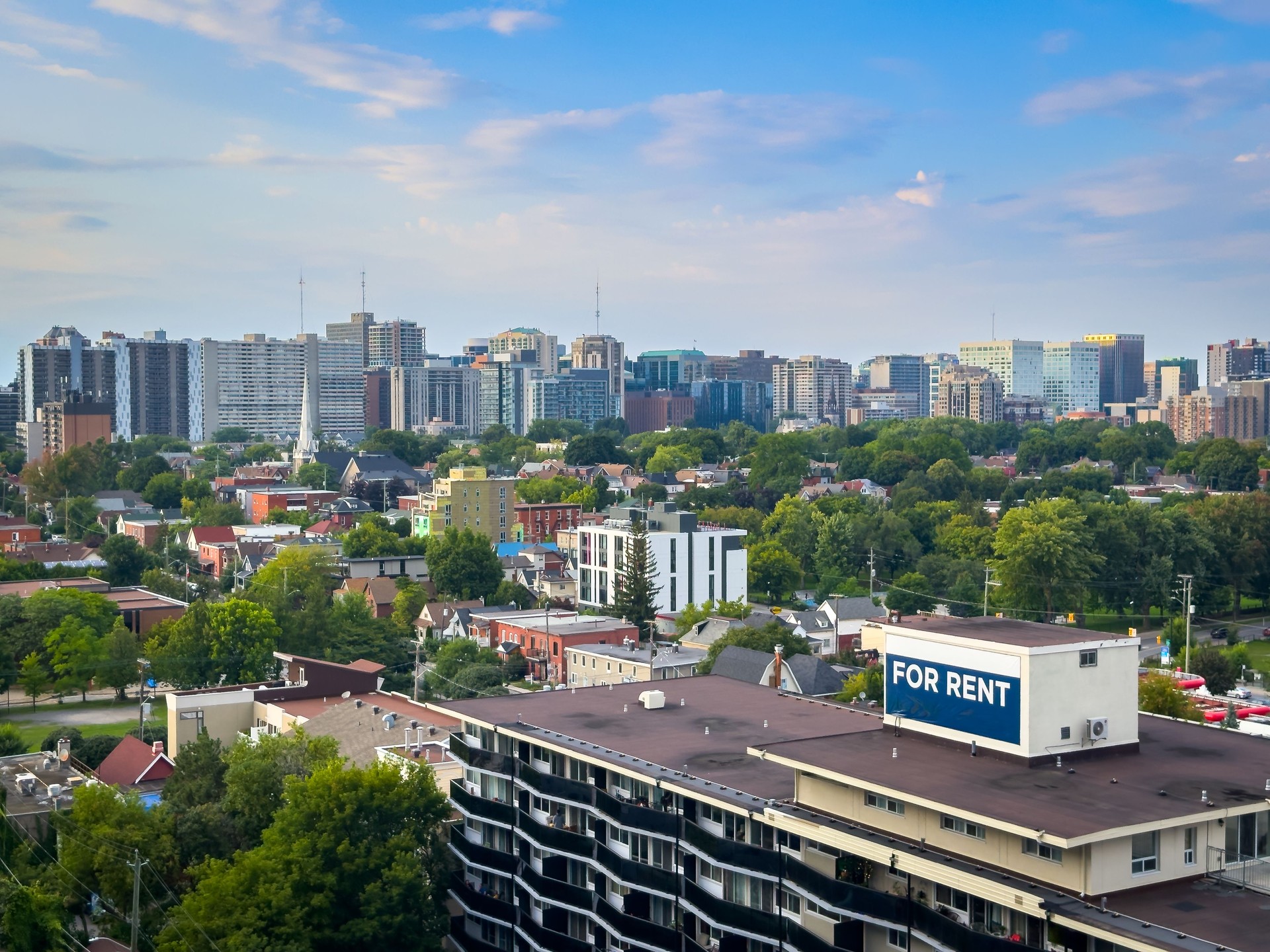 Apartment for rent sign, buildings and skyline, downtown Ottawa, Ontario, Canada